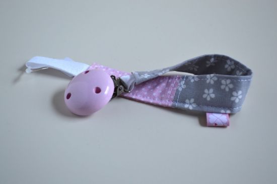 Bild von Schnullerband Blümchen grau/rosa